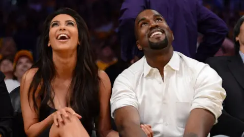 Getty Images Kim and Kanye watching LA Lakers play in 2012