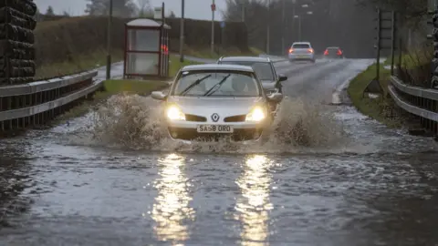 PA Media Flooding on Garrioch Road in Dumfries