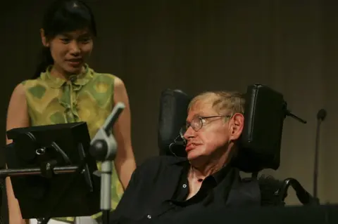 Getty Images British scientist Stephen Hawking looks at a Chinese student at a conference during the 2006 International Conference on String Theory on 21 June 2006 in Beijing, China