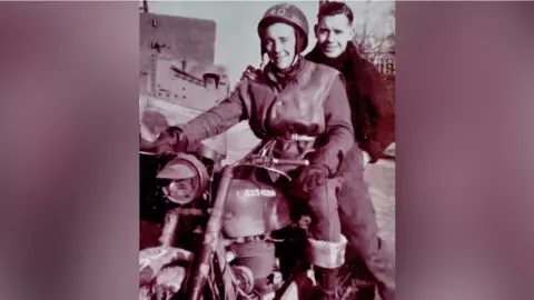 Family photo Don Sheppard, D-Day veteran, riding a motorbike during World War Two