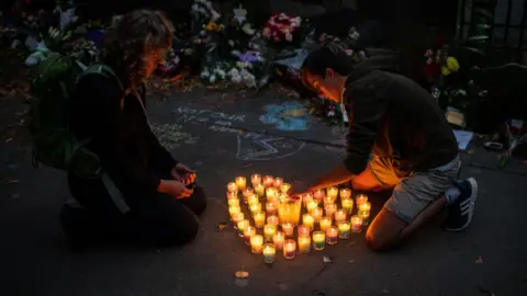 Getty Images Candles at a vigil for Christchurch