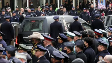 Reuters Officers lined the streets for the funeral of NYPD Detective Wilbert Mora