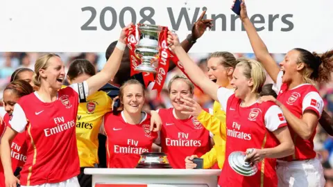 Laurence Griffiths/Getty Images Faye White and Jayne Ludlow of Arsenal lead the trophy celebrations in 2008