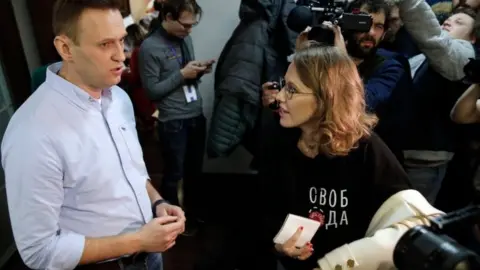 AFP Navalny and TV journalist Ksenia Sobchak speak at event on polling day