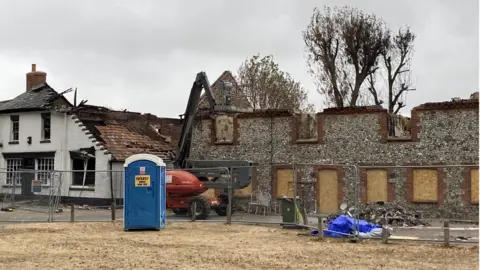 Jill Bennett/BBC Homes destroyed by a fire in Ashill, Norfolk