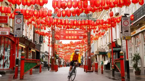 Reuters Cyclist in China Town