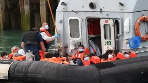 EPA A Border Force vessel with migrants picked from a boat off the Kent coast in August