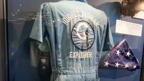 Central Intelligence Agency Coveralls and flag from the Howard Hughes exhibition