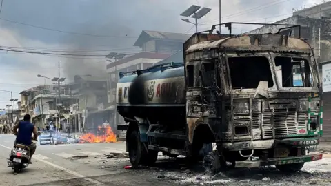 Reuters Burnt out water tanker in Manipur state, India