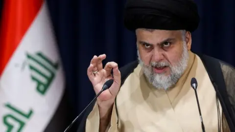 Reuters Moqtada al-Sadr speaks after the initial results of Iraq's election were announced (11 October 2021)