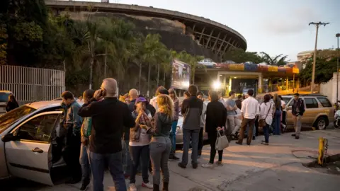 EPA Relatives wait for the prisoners to be released