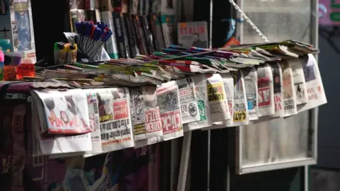 Newspapers are seen on sale at a kiosk in central Bucharest, Romania on April 30, 2019