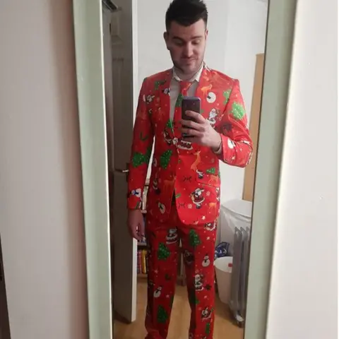 @TheSimonC9O @TheSimonC90 wearing a Christmas-themed suit