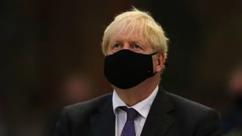 PA Media Boris Johnson wearing a face mask