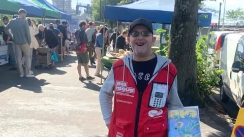 Stuart Drucker at Cardiff riverside market selling the Big Issue