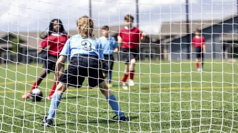 Getty Images Children play football