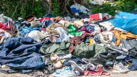 Getty Images Clothes on a landfill