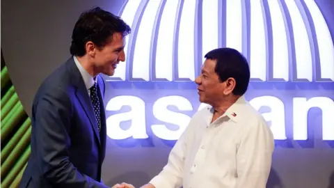 AFP/Getty Images Canadian Prime Minister Justin Trudeau greets Philippines President Rodridgo Duterte