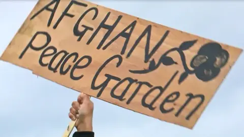 Sign at drone protest