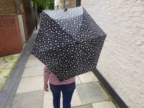 Verna Evans Woman with a star umbrella