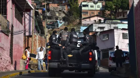 Getty Images Members of Venezuela's Special Action Forces (FAES) carry out a security operation in Caracas