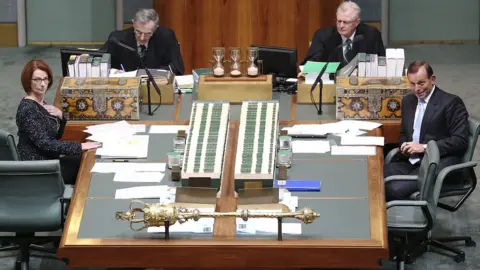 Getty Images Julia Gillard and Tony Abbott sit across from each other in parliament