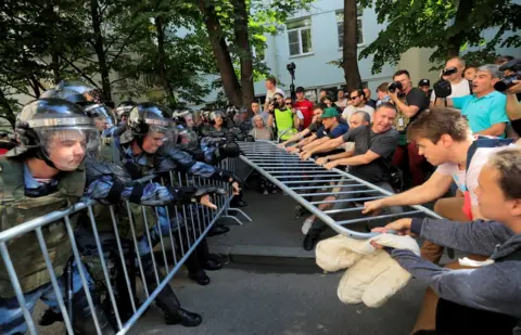 Reuters Police and protesters in Moscow, 27 July