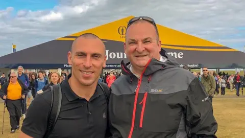 Celtic captain Scott Brown and a Rangers fan