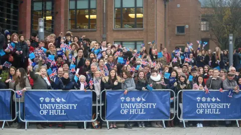 Danny Lawson/PA University of Hull staff and students cheering with union jack flags