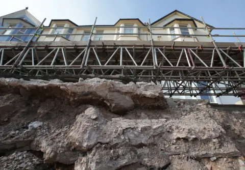 Getty Images Work to repair the Dawlish railway track