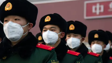 Getty Images Chinese policemen wearing face masks