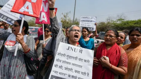 Getty Images Women's organisations demand the arrest of a professor accused of sexual misconduct