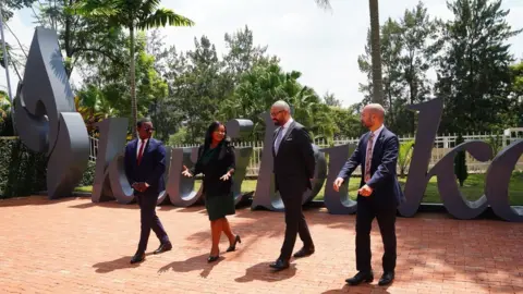 PA Media Home Secretary James Cleverly on a visit to Rwanda