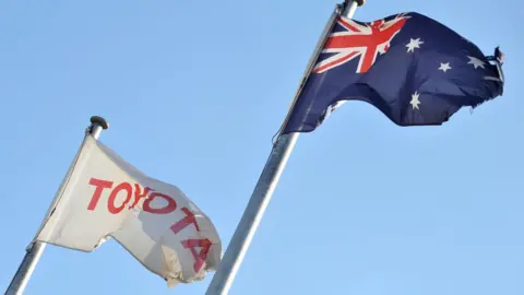 Getty Images Toyota flag flies next to the Australian flag