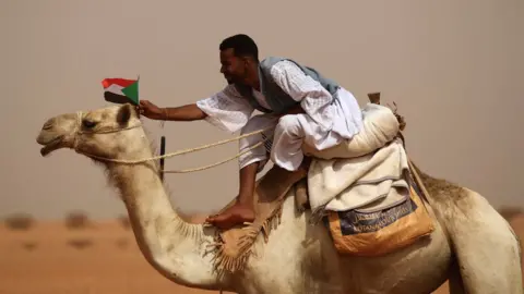 Reuters A supporter of Mohamed Hamdan "Hemedti" Dagalo outside Khartoum, Sudan