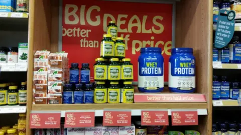 Cut price deals signs in-store