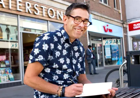 BBC Stephen O'Grady sketching in his pad