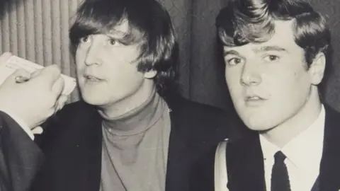 David Duggleby Auctioneers John Lennon (middle) interviewed by students in 1964