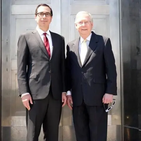 Facebook Senate Majority Leader Mitch McConnell and Treasury Secretary Steven Mnuchin at Fort Knox, according to a photo posted by Mr McConnell