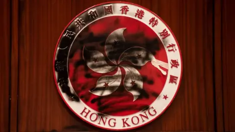 Getty Images Hong Kong emblem defaced by a graffiti during the demonstration At Legco