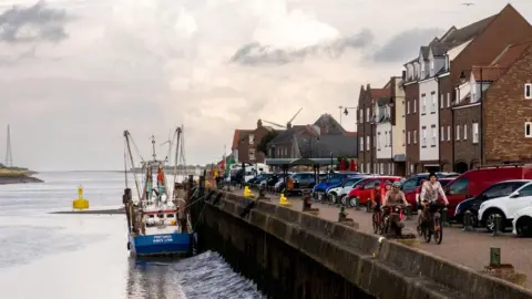 Cycling UK Cyclists on the quay side of King's Lynn on the Rebellion Way