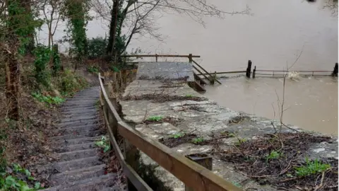 Chris Doel Steps leading down to Dundas Aqueduct with flood water at the bottom