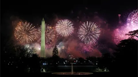 Reuters Fireworks burst over the Washington Monument during the "Celebrating America" event in Washington, DC., January 20, 2021