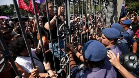 EPA A demonstration outside Brazil's National Museum in Rio de Janeiro after the fire which gutted the building on 2 September 2018