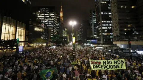 AFP Demonstrators against former Brazilian President Luiz Inacio Lula da Silva hold a rally demanding he must be jailed, in Sao Paulo, Brazil on April 03, 2018.