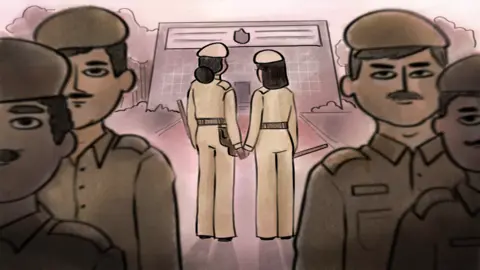 The women holding hands