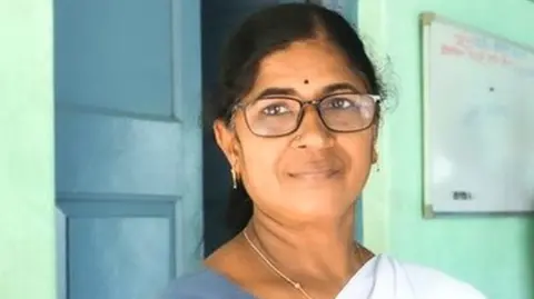 Kathija standing in her clinic