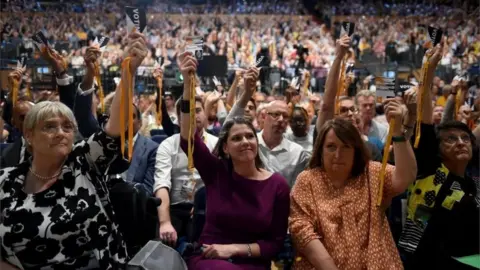 Getty Images Jo Swinson and delegates voting