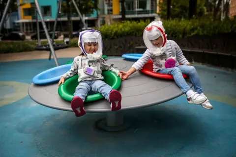  Juancho Torres/Anadolu Agency via Getty Images Children in helmets