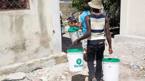 Oxfam/EPA Oxfam workers in Haiti in 2016